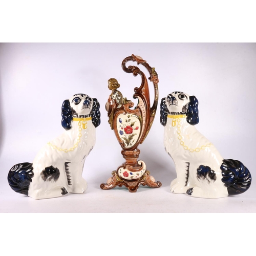 130 - Pair of Staffordshire spaniel dogs, and a Majolica ewer, 40cm.