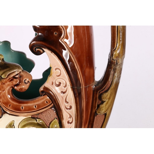 130 - Pair of Staffordshire spaniel dogs, and a Majolica ewer, 40cm.