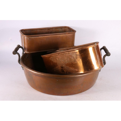 135 - Copper pan with raised handles, 35cm diameter, and two other bins. 