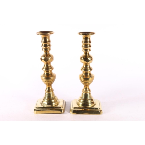 330 - Pair of diamond type brass candlesticks.