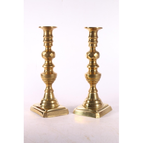 330 - Pair of diamond type brass candlesticks.