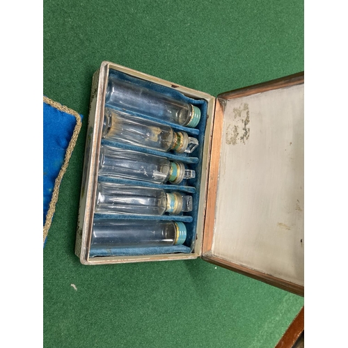 163 - Five glass vials housed in painted copper tin, 4 x 13 x10cm. 