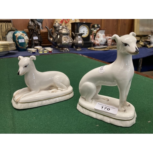 170 - Pair of 20th century dog figures. 15cm. 