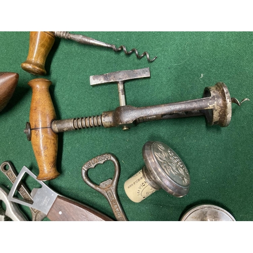 173 - Vintage fruitwood handled corkscrew, 18cm, along with bottle openers, etc. 