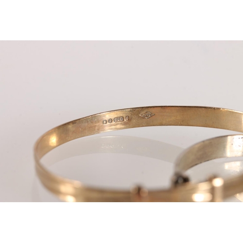 553 - Babies 9ct gold bangle, 3.5g and another silver.