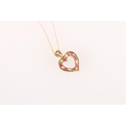 554 - Yellow metal heart shaped pendant set with red and white stones, 1.4g, on 9ct gold trace chain 0.3g.