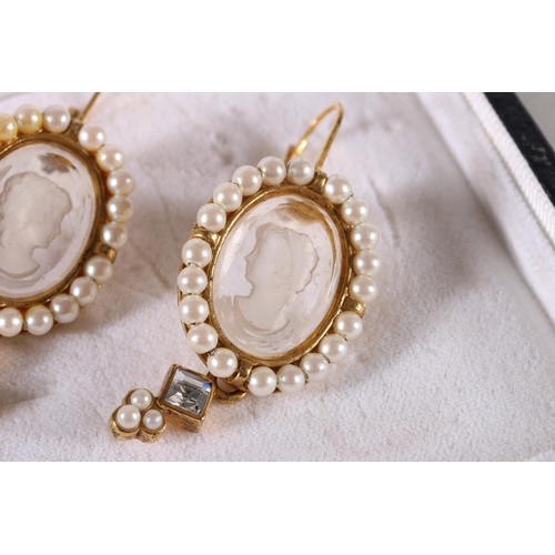 567 - Pair of gilt metal earrings with oval intaglio carved glass central panels depicting a bust length p... 