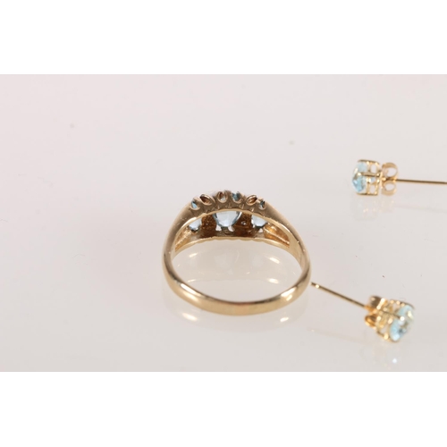 588 - 9ct gold diamond and blue stone dress ring 3.2g and a pair of similar earnings 0.7g.