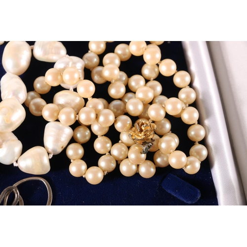 602 - Fresh water pearl necklace with white metal clasp, 41cm, along with two others including faux pearls... 