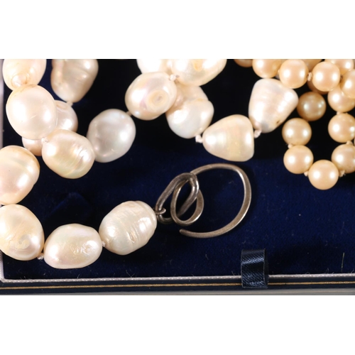 602 - Fresh water pearl necklace with white metal clasp, 41cm, along with two others including faux pearls... 