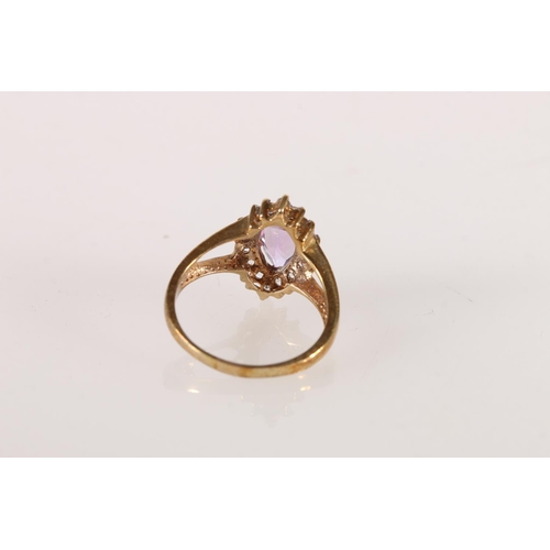 608 - 9ct gold dress ring with marquise cut amethyst surrounded by clear stones, size Q, 3.6g. 