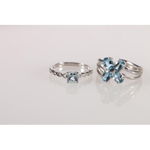 613 - 9ct white gold aquamarine set ring, size Q, and another with a single stone. 5.9g gross.