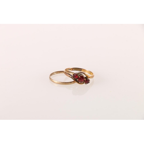 620 - 9ct gold cross over ring set with three red stones, size Q, and another wedding band, 3.2g. 