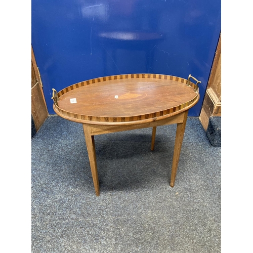 775 - Inlaid oval drinks tray attached to table base, 47cm.