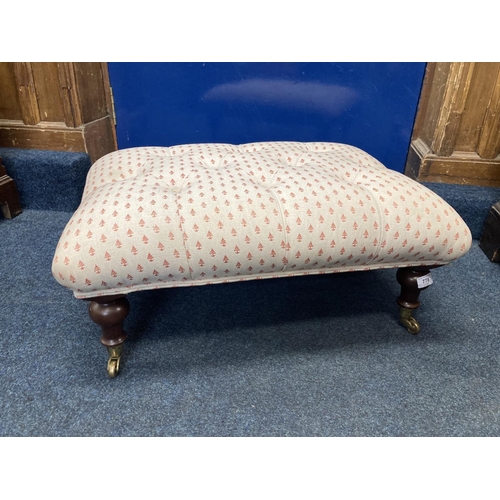 778 - Buttoned footstool with Christmas tree pattern on turned supports and castors, 30 x 70 x 53cm.