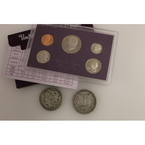 708 - UNITED STATES OF AMERICA USA Morgan dollars 1880 O and 1899 O, and a 1986 proof set.