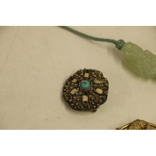 503 - Chinese jade coloured glass pendant in the form of a god, a Chinese mother-of-pearl and white metal ... 