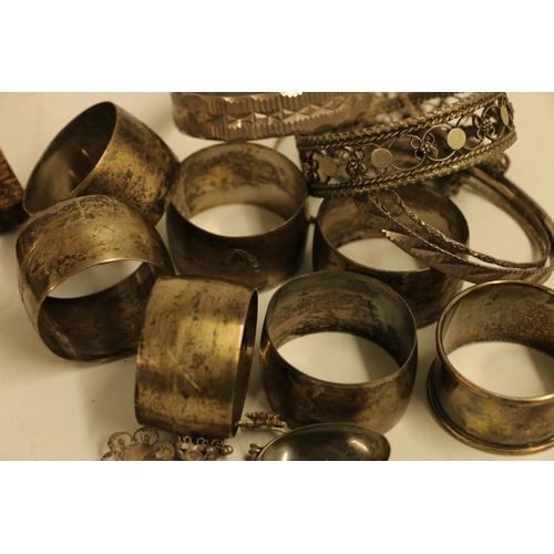 548 - Set of six Siamese/Iraqi type white metal neillo style engraved napkin rings, Eastern white metal ba... 