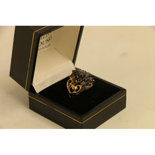 617 - 18ct gold hematite set cluster ring with pierced shoulders, size N, 6.5g. 