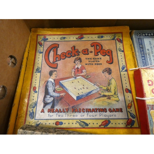 268 - Box of vintage board games to include snakes and ladders, Check a peg.