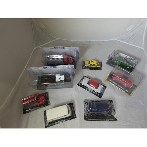 285 - Large collection of various boxed die cast taxis, police van, fire truck etc.