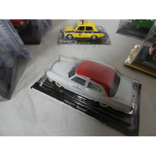 285 - Large collection of various boxed die cast taxis, police van, fire truck etc.