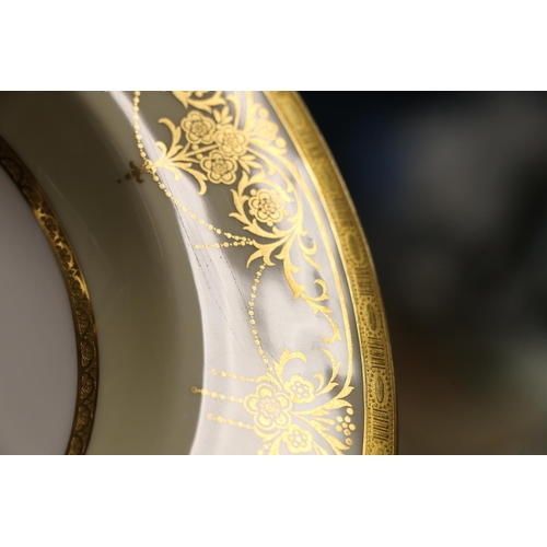 1 - Twelve early 20th century Minton rim soup plates, with foliate gilt decoration, retailed by Davis, C... 