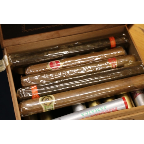 174 - Four boxes of cigars, Montecristos with eight tubes having cigars and one empty tube, etc..