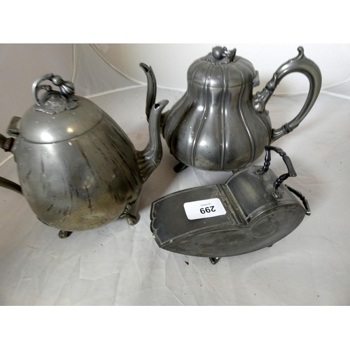 299 - Two large pewter tea pots.