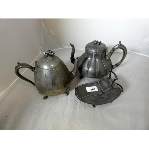 299 - Two large pewter tea pots.