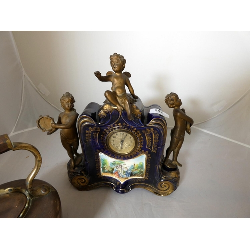 304 - Large Continental mantel clock surmounted by three angels and copper kettle.