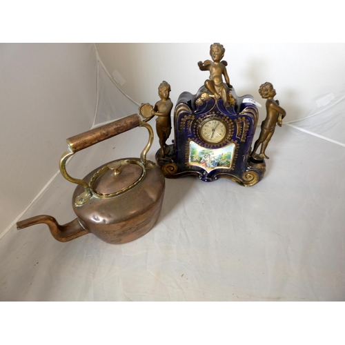 304 - Large Continental mantel clock surmounted by three angels and copper kettle.