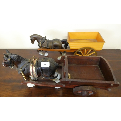 355 - Two vintage horse and cart figures.