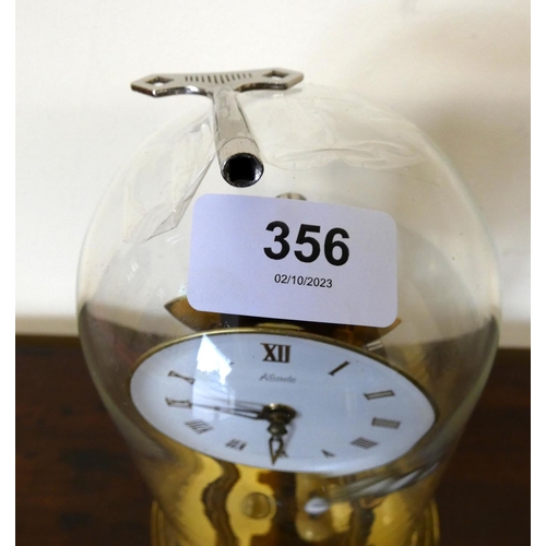 356 -  Kundo anniversary clock with glass.