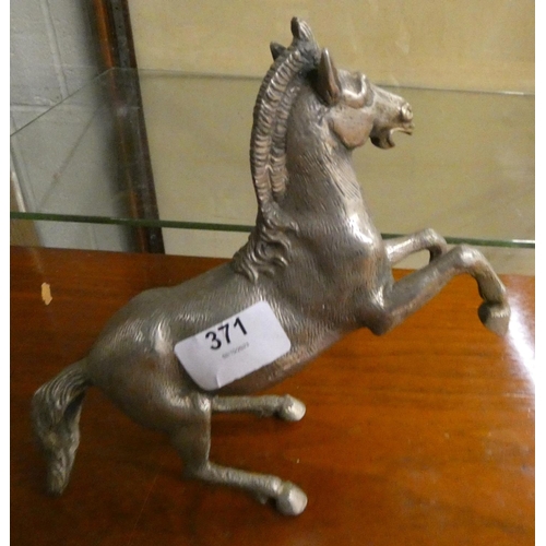 371 - Antique white metal prancing horse.