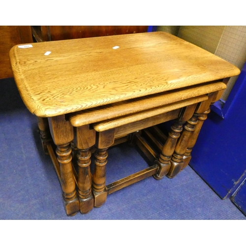 466 - Priory style oak nest of three tables.