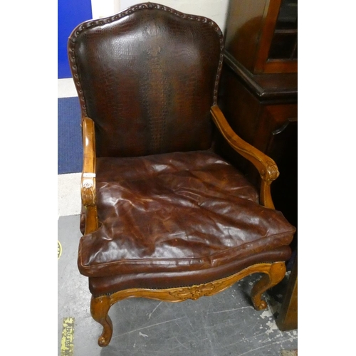 475 - Reproduction leather elbow chair.