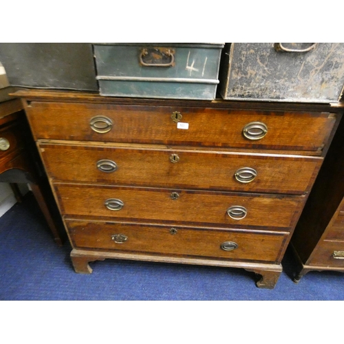 523 - George III oak chest of four long drawers on bracket feet.