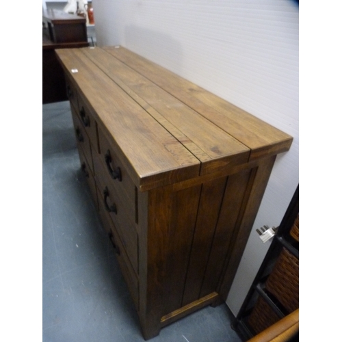 363 - Contemporary oak dresser base fitted with seven drawers.