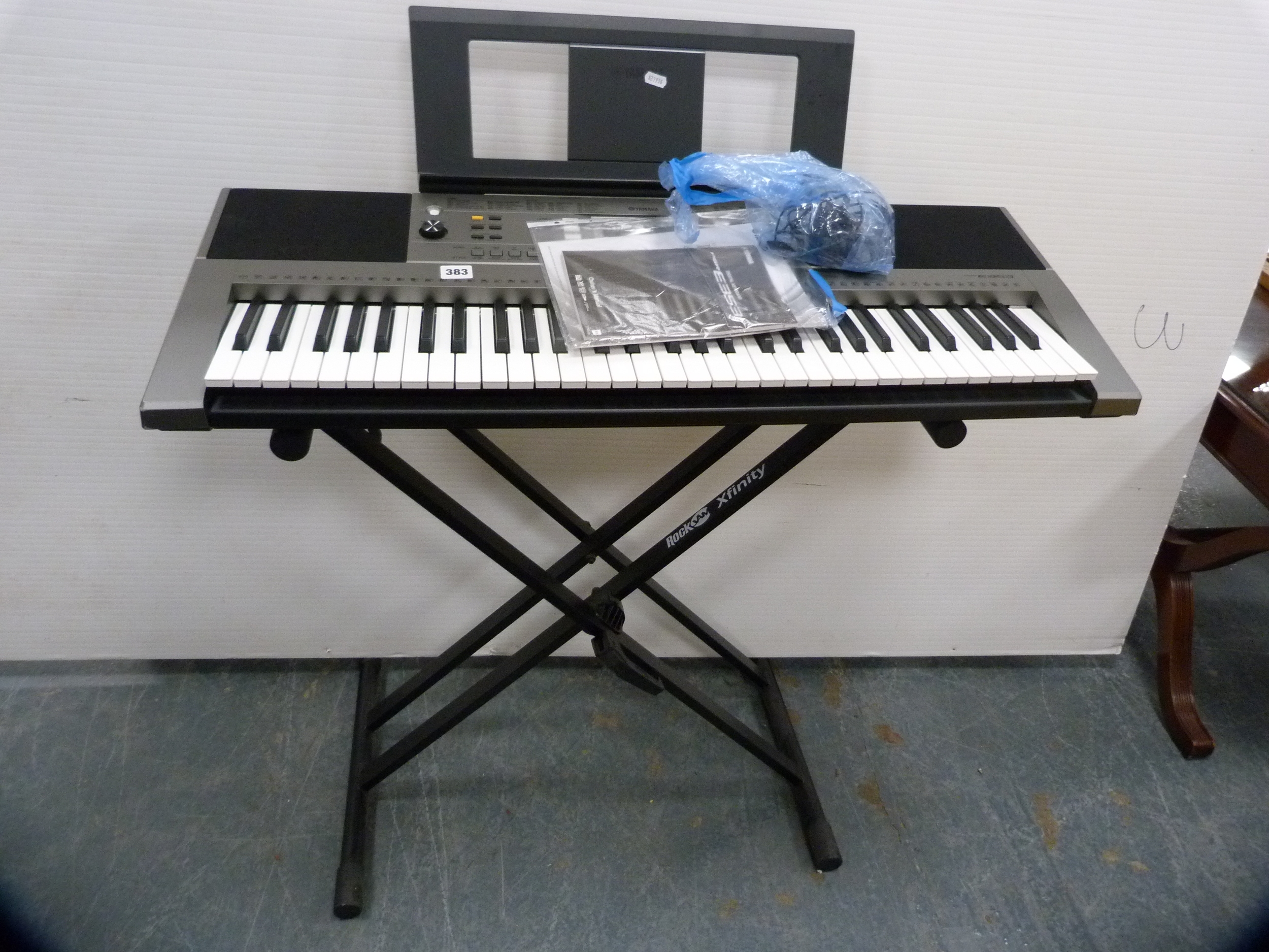 Yamaha PSR-E353 keyboard on stand.