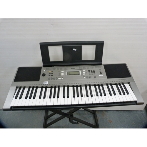 Yamaha PSR-E353 keyboard on stand.