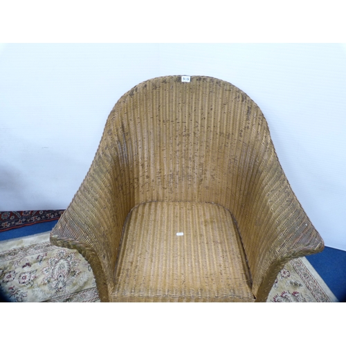 516 - Lloyd loom 'Lusty' armchair.