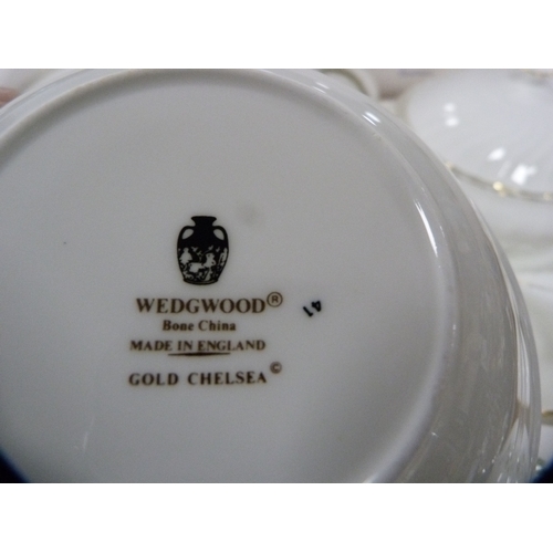 68 - Wedgwood 'Westbury' pattern part dinner set, and a Wedgwood 'Gold Chelsea' pattern part dinner set.