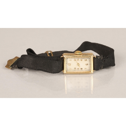 142 - Ladies 9 ct gold wrist watch with material strap