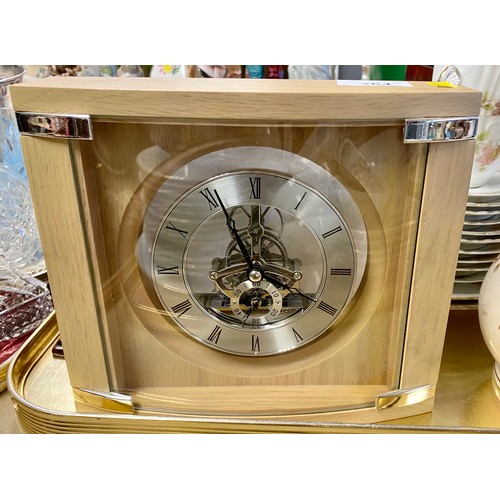 264 - Tray containing two mantle clocks, part tea set, art pottery jugs and vases