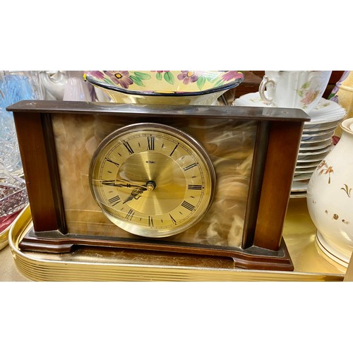 264 - Tray containing two mantle clocks, part tea set, art pottery jugs and vases