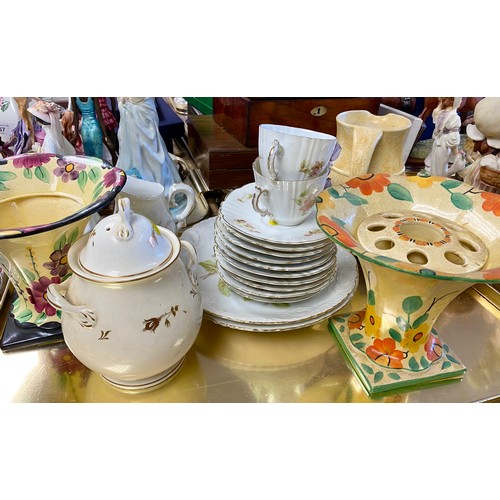 264 - Tray containing two mantle clocks, part tea set, art pottery jugs and vases