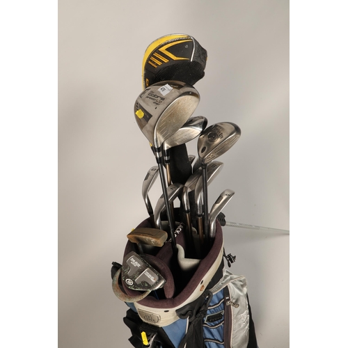 476 - Lynx golf bag containing various clubs, to include a king cobra speed club, top flight putter, and o... 