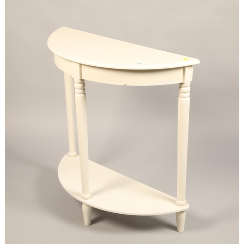 497 - White painted demi lune two tier hall table, 78cm diameter