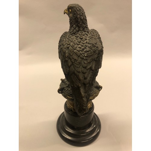 291 - After Archibald Thorburn (Scottish 1860-1935) Bronze figure of a perched golden eagle, on a marble p... 